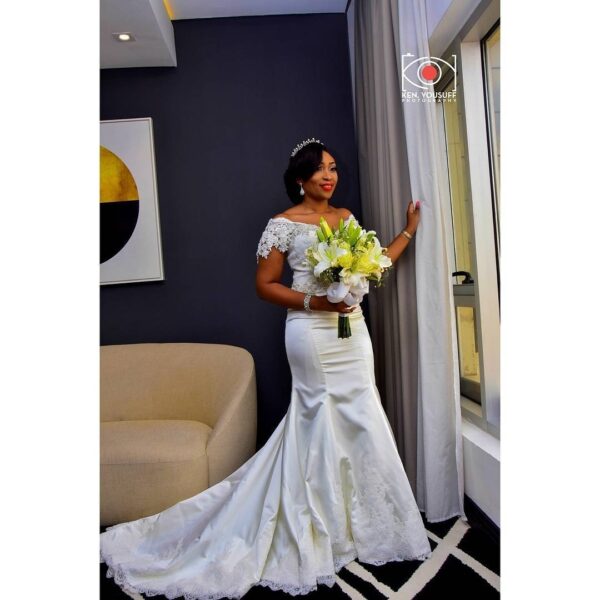 BRIDAL BOUQUET 119 - (White Calligraphy by Regal) white roses, lilies and gypsophila (million star) flowers . . . select size