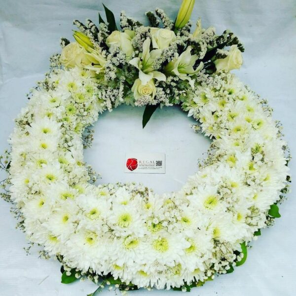 ETERNAL BLISS (FUNERAL WREATH) - Chrysanthemums (Lilac, White, Red, or Gold), Roses with Casablanca . . . select size