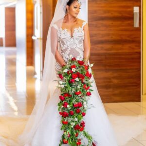 CASCADING BRIDAL BOUQUET  114 - Red roses, Carnations. . . more