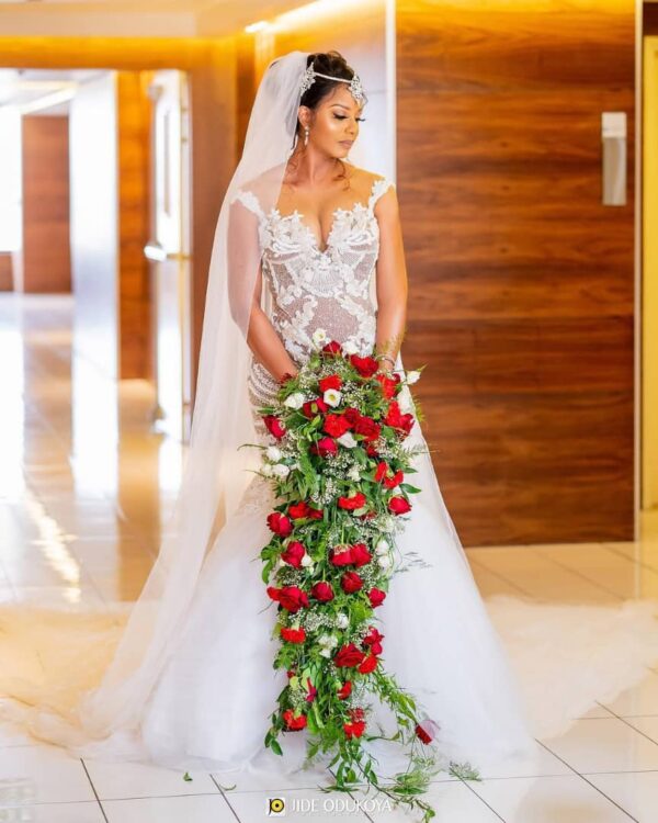 CASCADING BRIDAL BOUQUET  114 - Red roses, Carnations. . . more