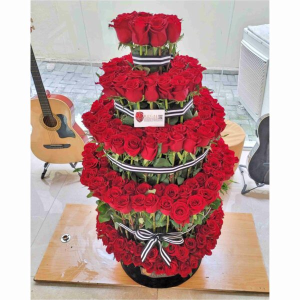 VIP Imperial – VIP Arrangement Of tiered roses and million stars . . .