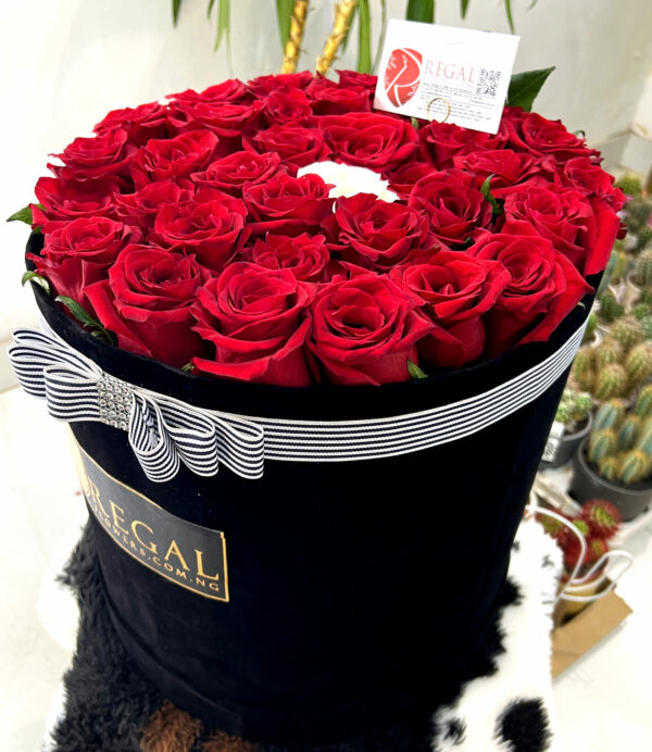 VIP THE ONE BOX ARRANGEMENT - Luxurious Bouquet of Roses With Contrasting Middle Rose. . .